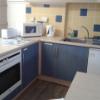 Versatile kitchen area, with kettle, microwave, fridge/freezer, toaster and oven
